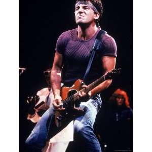  Singer Bruce Springsteen Playing Guitar While Performing 
