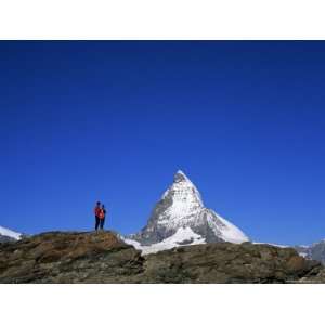 Hikers on Rocks and the Matterhorn, Rotenboden, Zermatt, Valais, Swiss 