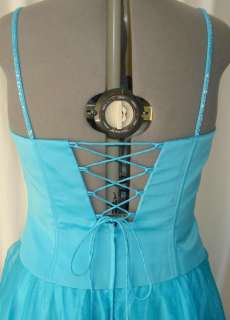   gown dress the color is turquoise the dress is made from satin bodice