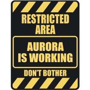   RESTRICTED AREA AURORA IS WORKING  PARKING SIGN