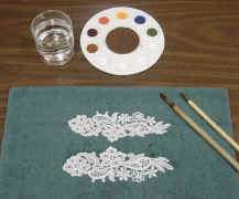 step 1 wet the lace you are going to paint and lay on a paper towel or 