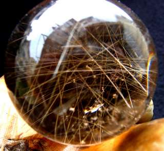 Expressions of Golden Rutile DT Quartz Crystal sphere  