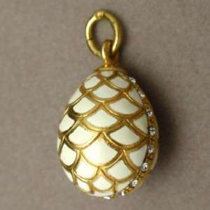 Egg shaped pendant or charm in 9k yellow gold with paste stones and 