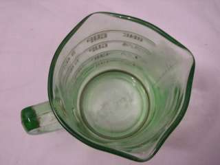 nice little green depression glass one cup measuring cup. Marked 