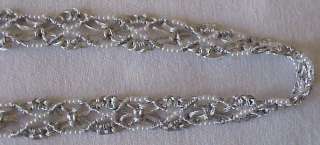 An elegant, hand made trim. Fashioned from metallic, silver, lurex 