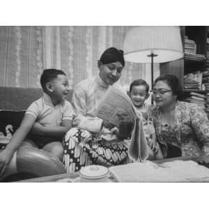  Indonesian Pres. Suharto Reading Newspaper to His Family 