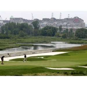 Golfers Play on the 18th Green at Liberty National Golf Club in Jersey 
