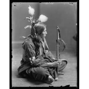  William Frog,Sioux American Indian,holding peace pipe 