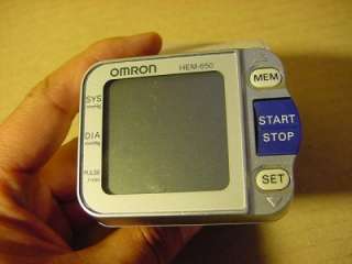 OMRON MODEL HEM 650 WRIST BLOOD PRESSURE MONITOR. USED BUT WORKS GOOD 